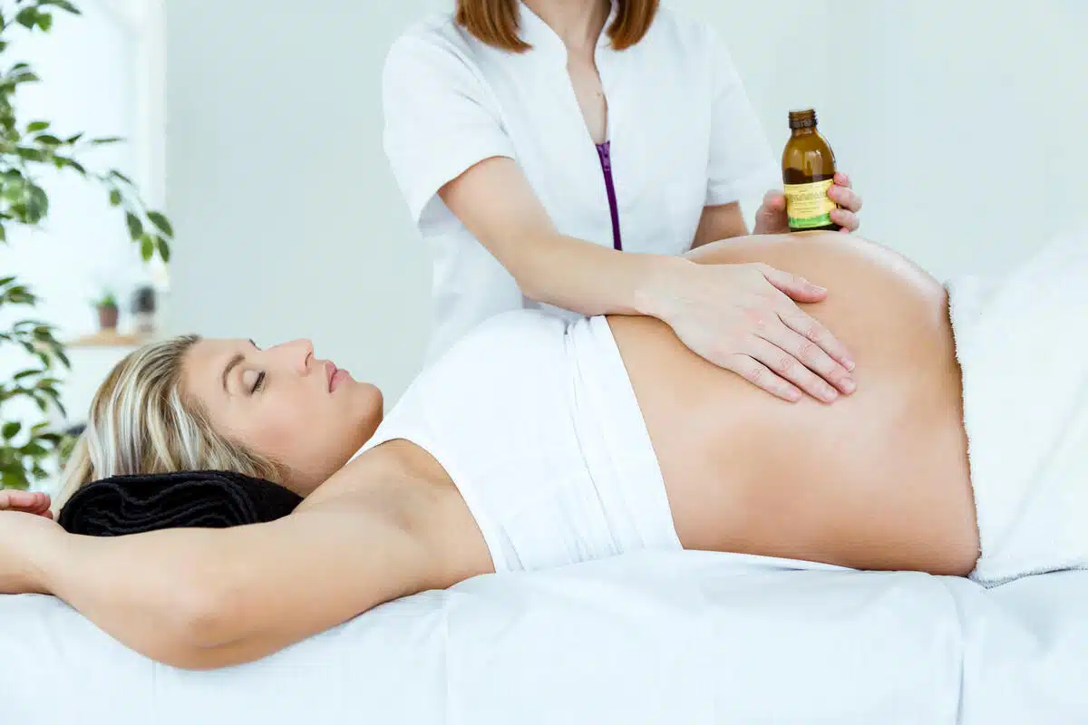 A pregnant woman getting checked by a medical specialist in a upward position