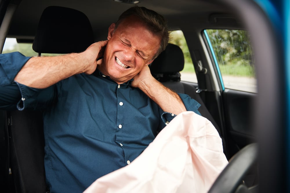 Chiropractor doing a myofascial therapy for his woman patient